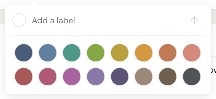 The label popover with its colour picker open, showing a grid of sixteen colour swatches beneath the label text field.