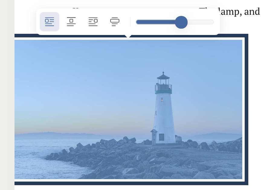 A selected inline image of a lighthouse with the floating image toolbar above it: left, center, right, and full-width alignment buttons, and a width slider.
